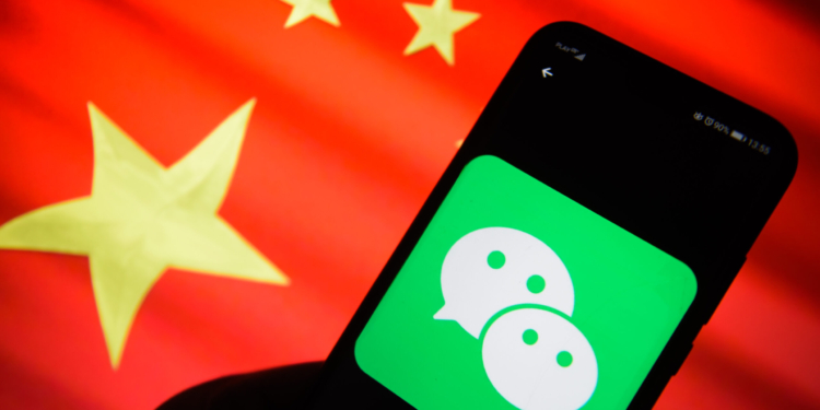 KRAKOW, POLAND - 2019/01/24: Wechat logo is seen on an android mobile phone with China's flag on the background. (Photo by Omar Marques/SOPA Images/LightRocket via Getty Images)