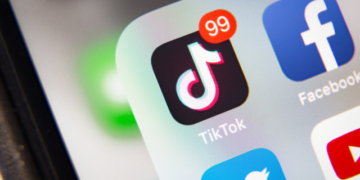 Tyumen, Russia - January 21, 2020: TikTok and Facebook application  on screen Apple iPhone XR