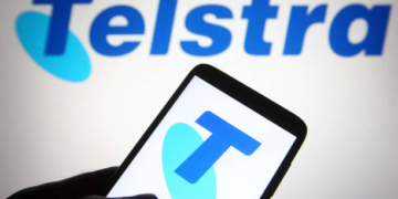 UKRAINE - 2021/07/01: In this photo illustration a Telstra (Telstra Corporation Limited) logo is seen on a smartphone and a pc screen. (Photo Illustration by Pavlo Gonchar/SOPA Images/LightRocket via Getty Images)