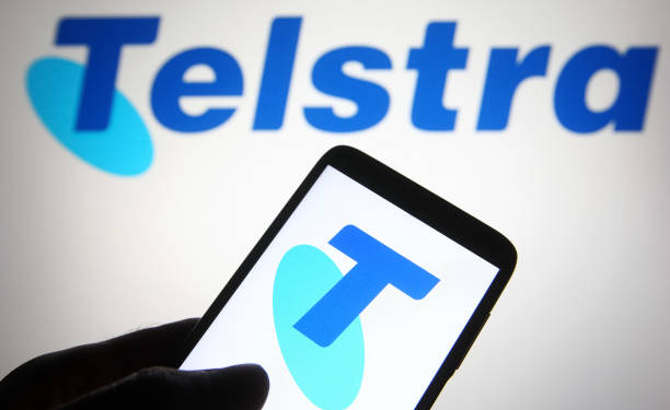 UKRAINE - 2021/07/01: In this photo illustration a Telstra (Telstra Corporation Limited) logo is seen on a smartphone and a pc screen. (Photo Illustration by Pavlo Gonchar/SOPA Images/LightRocket via Getty Images)
