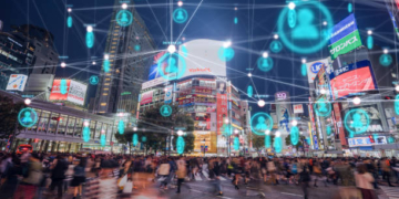 People and technology concept,Global communication icon with network connections line above crowded people walking .Internet of Things And smart city concept,Technology-Futuristic concept