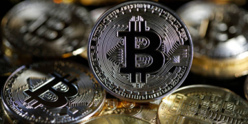 PARIS, FRANCE - FEBRUARY 09: In this photo illustration, a visual representation of the digital Cryptocurrency, Bitcoin is on display on February 09, 2021 in Paris, France. The value of Bitcoin (BTC) has exceeded the threshold of 48,000 dollars for the first time in history. Electric vehicle maker Tesla has invested $ 1.5 billion in the virtual currency and will begin accepting it as payment for the purchase of its cars, the group said. The move comes days after Elon Musk temporarily changed his Twitter mini-description to simply #bitcoin.  (Photo illustration by Chesnot/Getty Images)