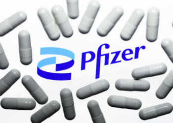 Pfizer logo displayed on a laptop screen and medical pills are seen in this illustration photo taken in Krakow, Poland on October 18, 2021. (Photo by Jakub Porzycki/NurPhoto via Getty Images)