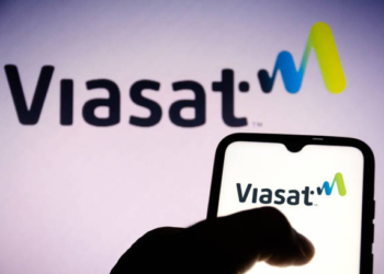 BRAZIL - 2021/06/16: In this photo illustration, a Viasat Inc. logo seen displayed on a smartphone and in the background. (Photo Illustration by Rafael Henrique/SOPA Images/LightRocket via Getty Images)
