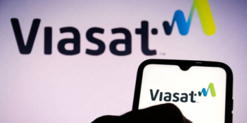 BRAZIL - 2021/06/16: In this photo illustration, a Viasat Inc. logo seen displayed on a smartphone and in the background. (Photo Illustration by Rafael Henrique/SOPA Images/LightRocket via Getty Images)
