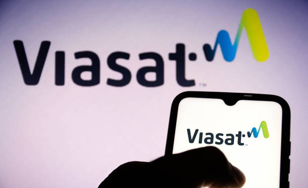 BRAZIL - 2021/06/16: In this photo illustration, a Viasat Inc. logo seen displayed on a smartphone and in the background. (Photo Illustration by Rafael Henrique/SOPA Images/LightRocket via Getty Images)