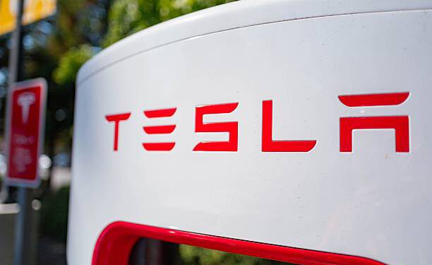 Close up of Tesla logo on a charger at a Supercharger rapid battery charging station for the electric vehicle company Tesla Motors, in the Silicon Valley town of Mountain View, California, August 24, 2016. (Photo by Smith Collection/Gado/Getty Images).