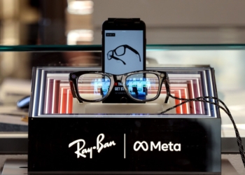 A pair of Ray-Ban Meta smart glasses in a Ray-Ban eyewear store in Rome, Italy, on Friday, July 11, 2025. Meta Platforms Inc. bought a minority stake in the world's largest eyewear manufacturer, EssilorLuxottica SA, deepening the US tech giant's commitment to the fast-growing smart glasses industry, according to people familiar with the matter. Photographer: Alessia Pierdomenico/Bloomberg via Getty Images